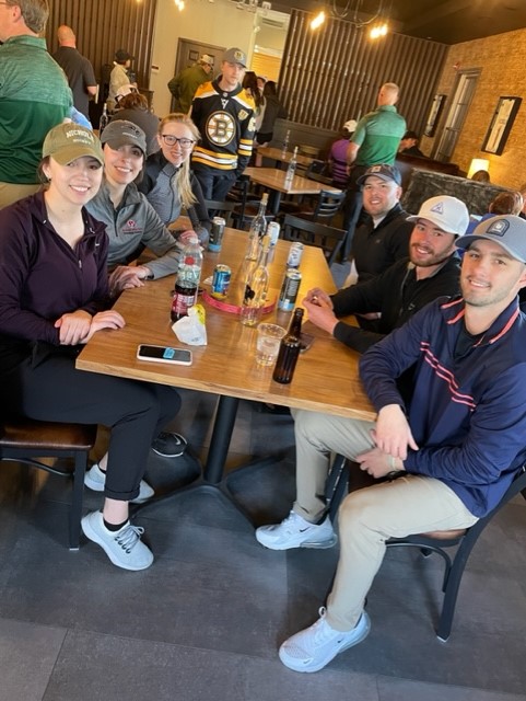 group of people around a table at Bison Den